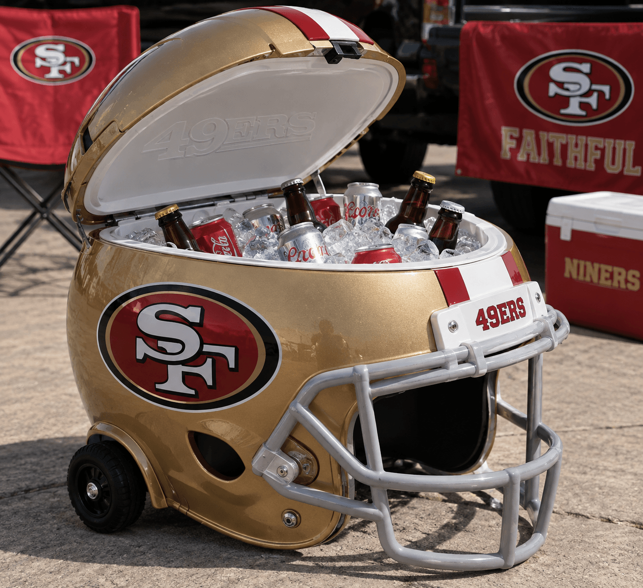San Francisco 49ers helmet-shaped cooler with its lid open and built-in wheels at a tailgate.